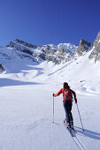 Female backcountry skier ascending Felbespitze, Pfitschertal, Zillertal Alps, South Tyrol, Trentino-Alto Adige/Südtirol, Italy