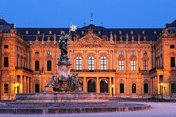 Illuminated fountain Frankoniabrunnen and Wuerzburger residence at night, Wuerzburg, UNESCO World Heritage Site Wuerzburg, Bavaria, Germany