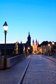 Illuminated bridge Alte Mainbruecke and city of Wuerzburg in the evening light, Wuerzburg, Bavaria, Germany