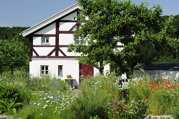 Half-timbered house with garden, Altmuehl valley cycle trail, Altmuehl, Bavaria, Germany