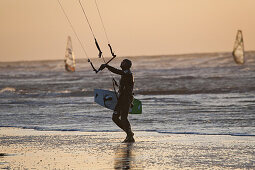 Kite surfer on the beach at St Peter-Ording, Evening light, Schleswig-Holstein, North Sea coast, Germany