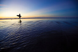 Surfer at beach, Istmo de la Pared, Fuerteventura, Spain