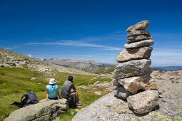 Mountaineers practice mountaineering in the mountains of the Sierra de Gredos National Park  At the end of the image the summit of Almanzor peak  Navacepeda de Tormes  Ávila  Castilla y León  Spain