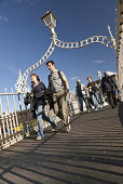 Passers-by on the Ha'Penny Bridge, Dublin, County Dublin, Ireland