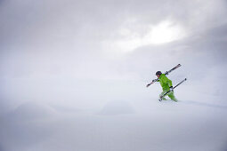 Male free skier ascending in deep snow, Mayrhofen, Ziller Valley, Tyrol, Austria