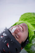 Man lying in snow, Mayrhofen, Ziller Valley, Tyrol, Austria
