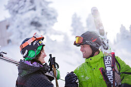 Two male free skiers shaking hands, Mayrhofen, Ziller river valley, Tyrol, Austria