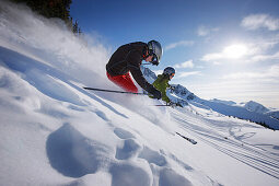 Skiers downhill skiing at Blackcomb Peak, British Columbia, Canada