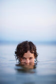 Woman bathing in lake Starnberg, Ambach, Munsing, Bavaria, Germany