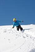 Child skiing in deep snow, Schlosslelift, Hirschegg, Kleinwalsertal, Vorarlberg, Austria