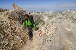 Mountaineer at summit of Corno Grande, Gran Sasso National Park, Abruzzi, Italy, Europe