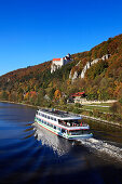 Excursion ship on river Altmuehl, Prunn castle in background, Altmuehltal nature park, Riedenburg, Bavaria, Germany