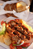 Greek dish Souvlaki, pork or lamb meat pieces grilled on skewers, Prefecture Lasithi, Crete, Greece