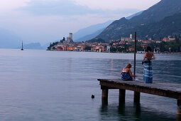 Women, Boardwalk, Evening mood, Malcesine, Lake Garda, Veneto, Italy