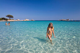 Woman at beach of Palombaggia, Corsica, France