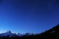 Starry sky above Lauteraarhorn, Schreckhorn, Finsteraarhorn and Eiger, Grindelwald, UNESCO World Heritage Site Swiss Alps Jungfrau - Aletsch, Bernese Oberland, Bern, Switzerland, Europe