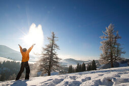 Man throwing snow in air, Styria, Austria