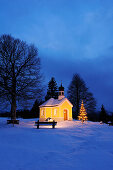 Illuminated chapel with Christmas tree, Werdenfelser Land, Upper Bavaria, Bavaria, Germany, Europe