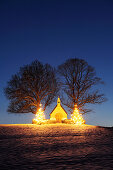 Illuminated chapel with two illuminated Christmas trees, lake Chiemsee, Chiemgau, Upper Bavaria, Bavaria, Germany, Europe