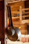 Two old rustic pans on wooden post, Tyrol, Austria