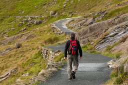 Hiker on the Miners Track towards Mt. Snowdon, Snowdonia National Park, Wales, UK