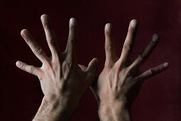 Hands with fingers splayed
