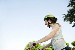 Teen girl riding bicycle