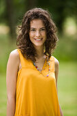 Portrait of young woman, smiling