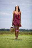 Young woman on grass, oudoors