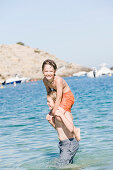 2 children having fun in the sea