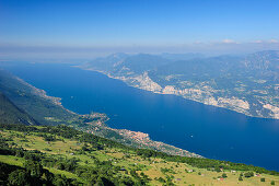 View over lake Garda with Malcesine  and mountain range of Lake Garda, Monte Baldo, Trentino-Alto Adige/Suedtirol, Italy