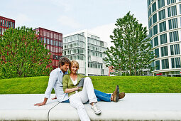 Couple with a tablet computer, HafenCity, Hamburg, Germany