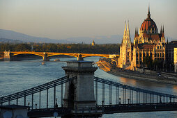 View of Danube river, Chain Bridge and House of Parliament in the evening, Budapest, Hungary, Europe