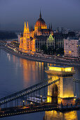 View of Danube river, Chain Bridge and House of Parliament at night, Budapest, Hungary, Europe