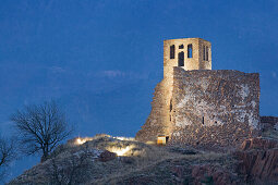 The illuminated ruins of Sigmundskron castle in the evening, Bozen, South Tyrol, Italy, Europe