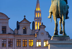 Equestrian monument and illuminated steeple in the evening, Statue du roi Albert, Place de L'Albertine, Brussels, Belgium, Europe