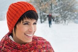 Young woman in winter clothes smiling