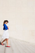 Woman moving down steps, Paris, Ile-de-France, France