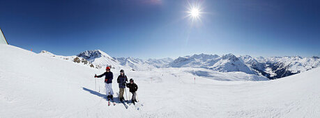Three young skiers, Mountain Panorama, Zuers, Arlberg, Austria