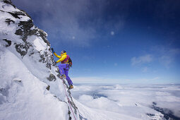 Mountaineer on the southwest ridge of Moench, Grindelwald, Bernese Oberland, Switzerland