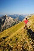 Woman walking on a trail, Vorderes Sonnwendjoch, Rofan range, Brandenberg Alps, Tyrol, Austria