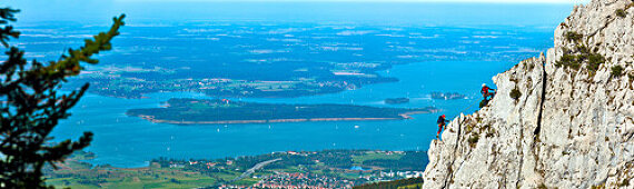 Mountaineers at Staffelstein, Kampenwand, lake Chiemsee in background, Chiemgau, Upper Bavaria, Germany