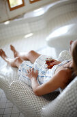 Woman enjoying a cup of tea in a spa hotel, Am Hochpillberg, Schwaz, Tyrol, Austria