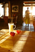 Steaming tea and apples on the table of the Panorama Room, Ecohotel Grafenast, Am Hochpillberg, Schwaz, Tyrol, Austria
