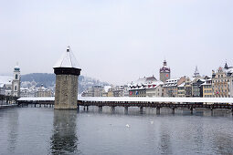 Chapel bridge Kapellbruecke with water tower, Wasserturm and covered wooden bridge above river Reuss, Lucerne, Switzerland