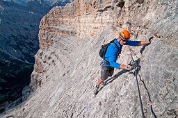 Elijah Weber climbing the Giovanni Lipella via ferrata on Tofana De Rozes in the Dolomite Mountains near the city of Cortina in northern Italy