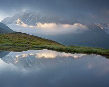 Mountain reflection in a mountain lake, View from Oberberg towards Hochfeiler (3510m), Pfitsch Valley, South Tirol, Italy
