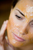 young woman with chocolate_mask closeup