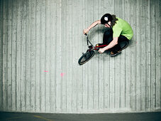 Man doing tricks on bmx bike indoors. Man doing tricks on bmx bike indoors