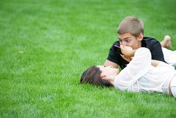 Young couple lying in a meadow, Vienna, Austria